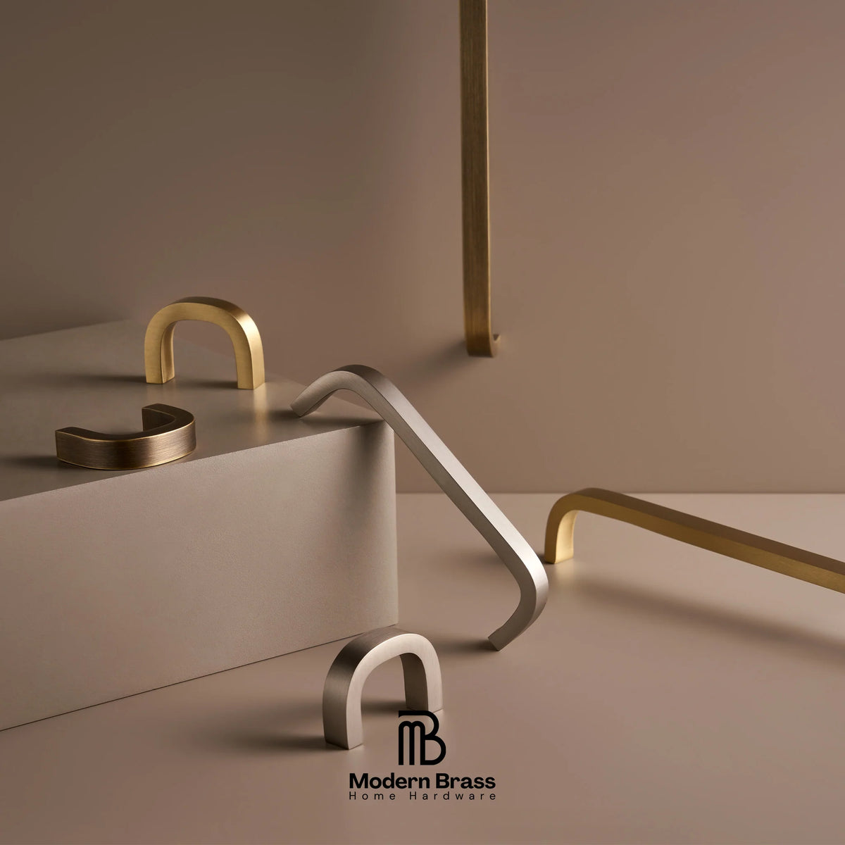 Three round cabinet knobs in black, matte brass, and brushed brass are arranged on a light beige surface against a warm beige background. The Modern Brass logo is visible at the bottom.