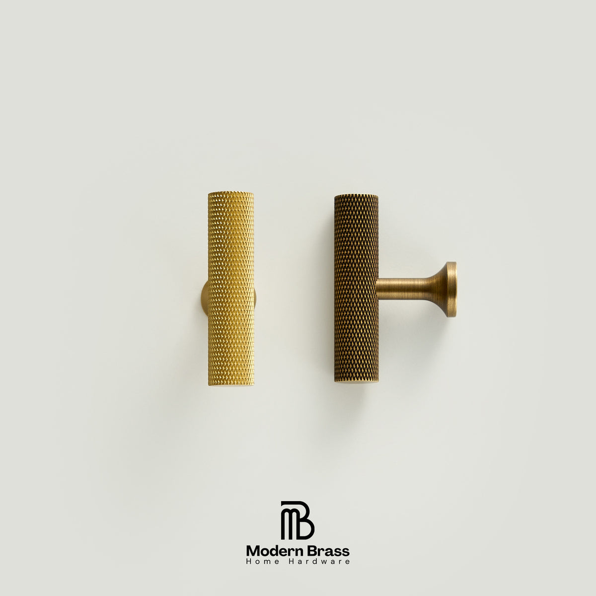 Two modern cylindrical cabinet pulls with a textured honeycomb finish, shown side-by-side on a light gray background. One is a bright gold brass and the other is a darker bronze.