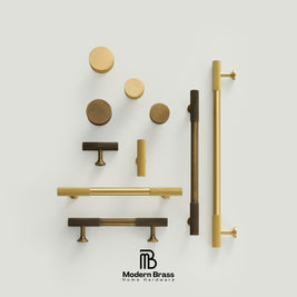 Three round cabinet knobs in black, matte brass, and brushed brass are arranged on a light beige surface against a warm beige background. The Modern Brass logo is visible at the bottom.