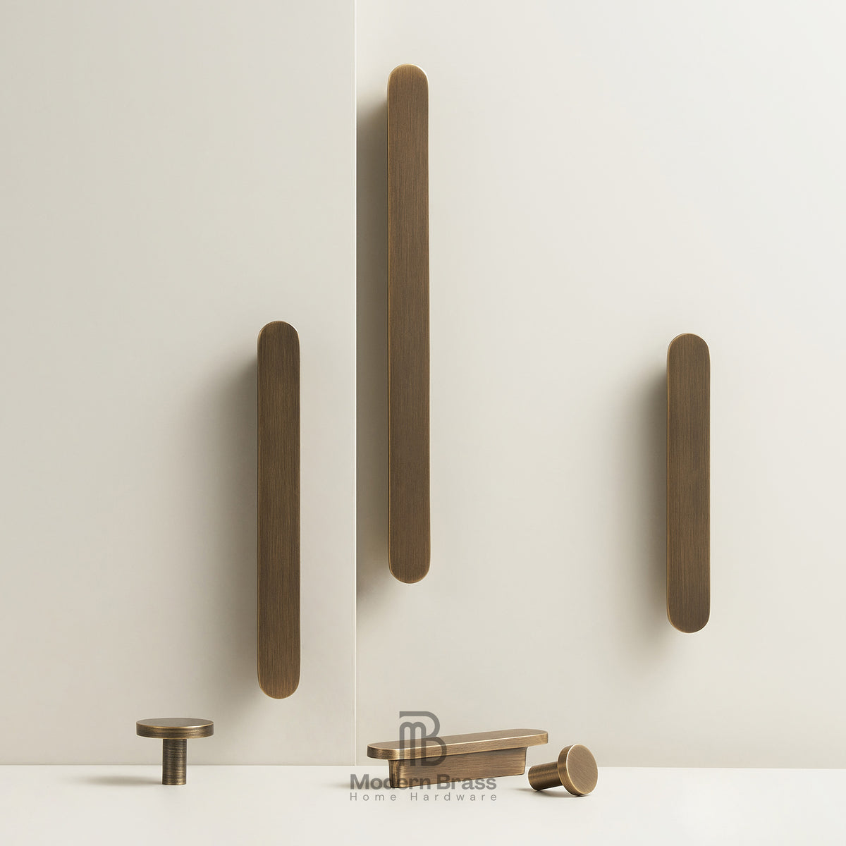 Set of bronze cabinet handles on a white background