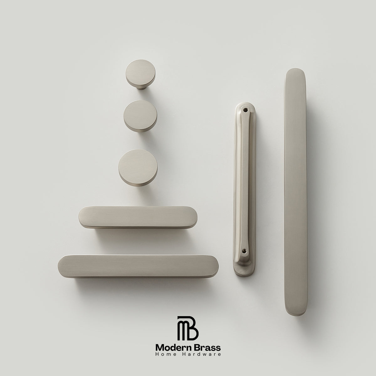 Set of modern door handles and locks on a light gray background with 'Modern Brass' branding.