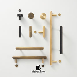 An assortment of modern cabinet handles and knobs in matte black and brushed brass, arranged neatly on a clean white background with the Modern Brass logo at the bottom.