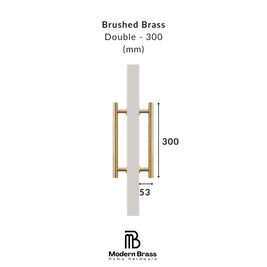 Technical dimension diagram of a brushed brass double door handle, labeled 'Brushed Brass Double - 300 (mm)' with measurements '300' and '53', on a white background. Modern Brass Home Hardware logo is shown at the bottom.