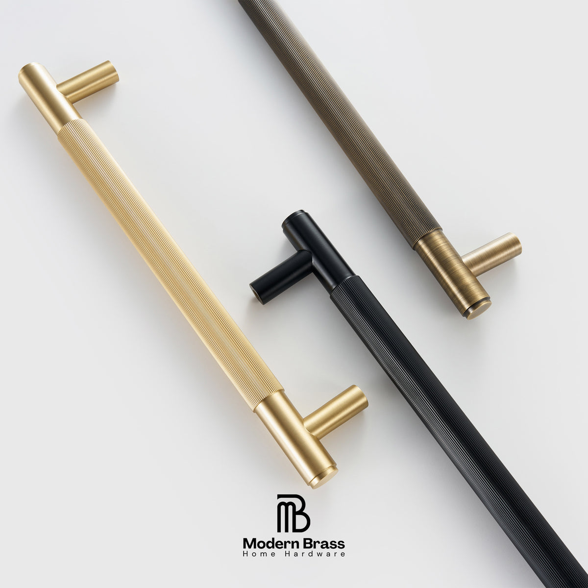 Three metallic door handles in gold, bronze, and black on a white background with 'Modern Brass' branding.