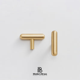 Two brass cabinet hardware pulls, one T-bar and one round cap, shown on a clean white background with the Modern Brass logo at the bottom.