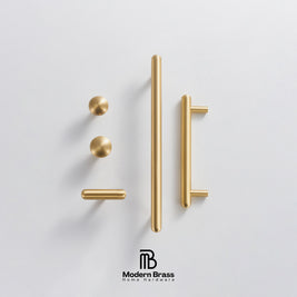Modern brass door hardware set including two round knobs, two bar pulls, and two end caps, arranged on a light gray background with the Modern Brass Home Hardware logo at the bottom.