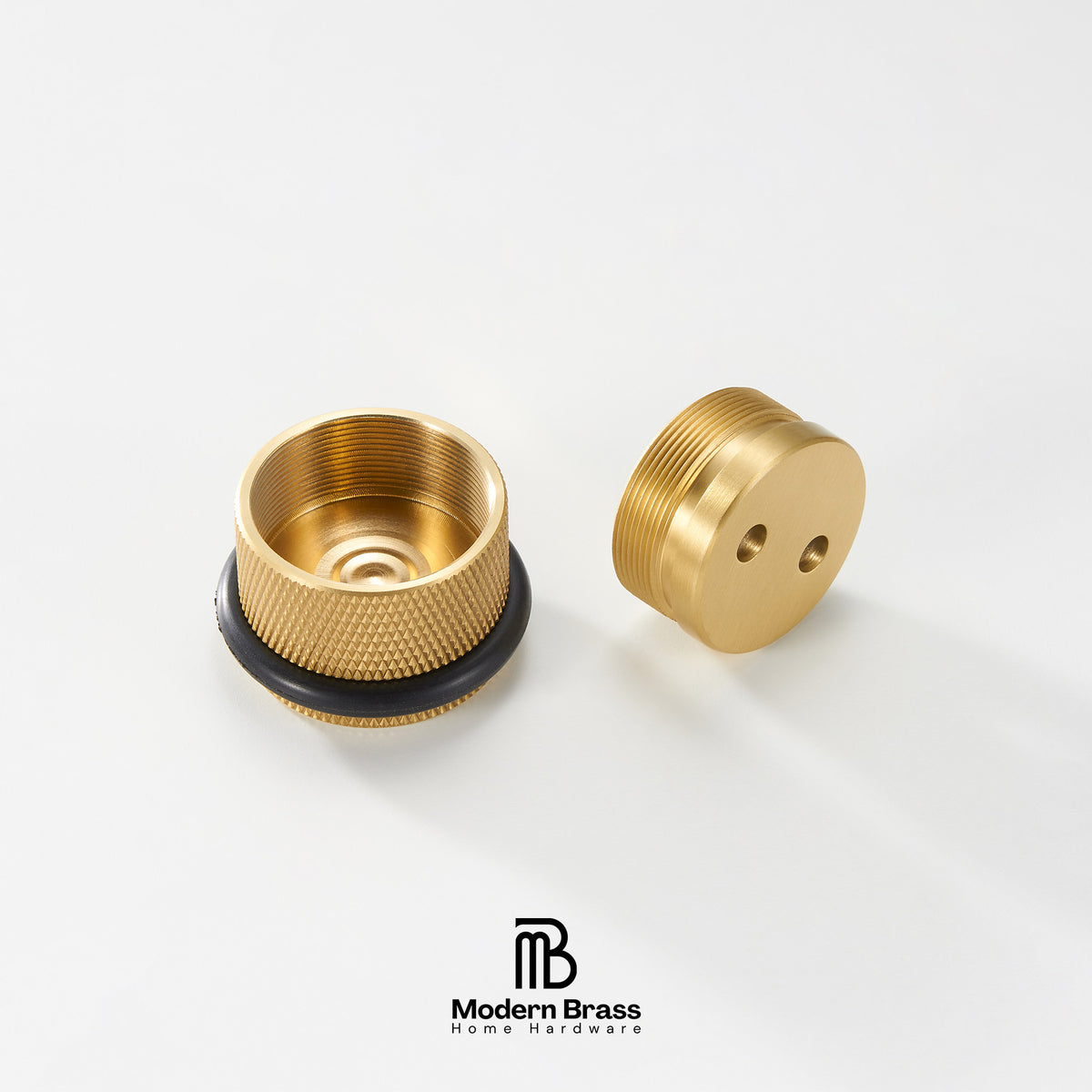 Two brass home hardware components, likely a threaded cap and a matching base, displayed on a clean white background with the Modern Brass logo at the bottom.
