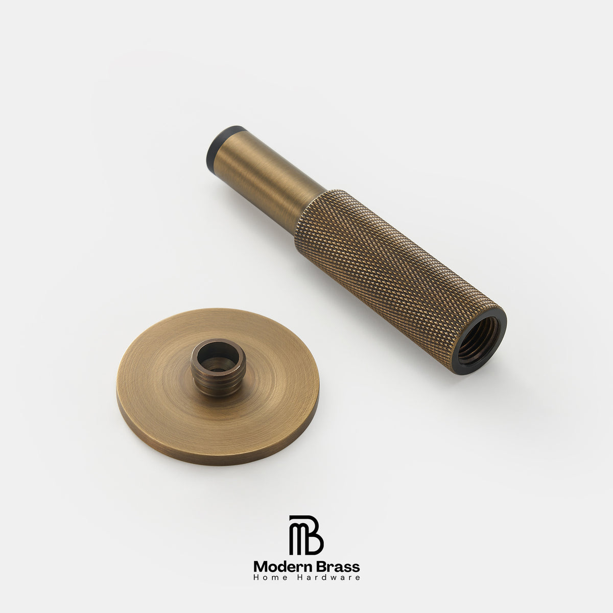An antique brass hardware component set consisting of a threaded rod with a knurled grip and a matching round base plate, displayed on a clean white background with the Modern Brass logo at the bottom.