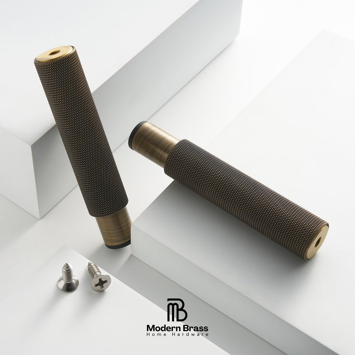 Two brass wall anchors with textured dark gray mesh sleeves, shown on a clean white geometric background with two silver screws and the Modern Brass logo.