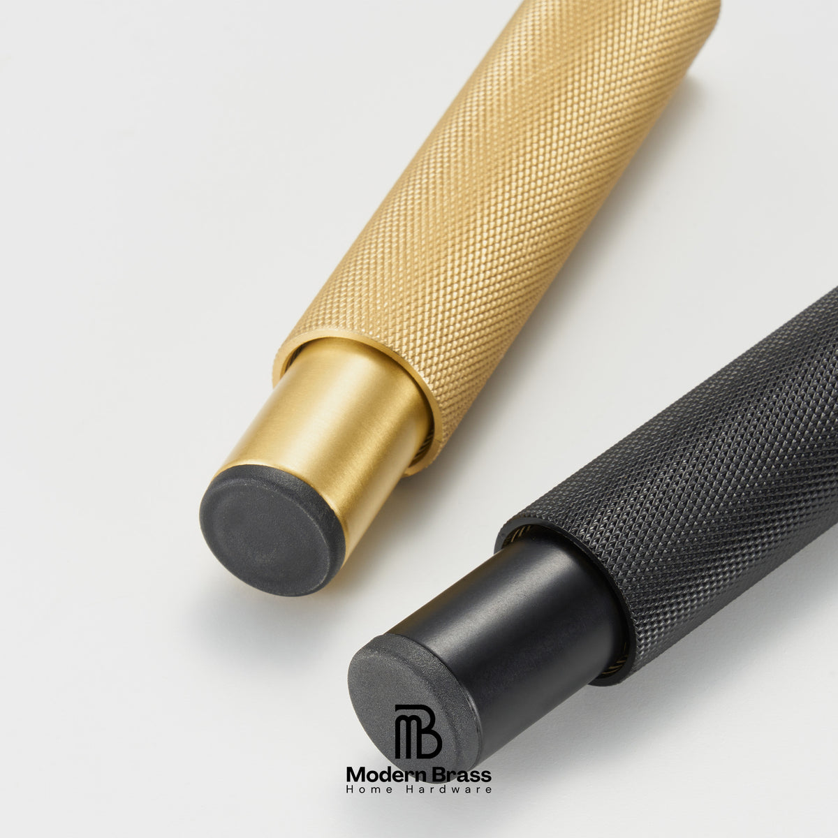 Two brass home hardware tools with knurled textured handles, one in polished gold and one in black, shown on a light gray background with the Modern Brass logo.