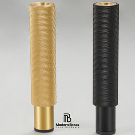Two cylindrical brass and black home theater speaker drivers shown side-by-side on a light gray background, with the Modern Brass logo at the bottom.