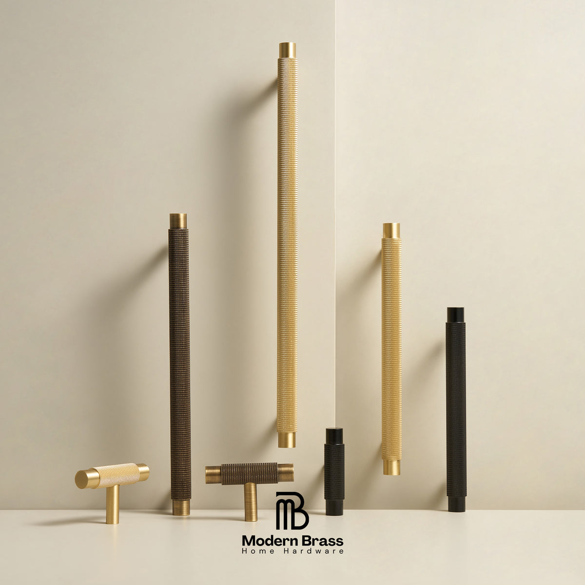 Three round cabinet knobs in black, matte brass, and brushed brass are arranged on a light beige surface against a warm beige background. The Modern Brass logo is visible at the bottom.