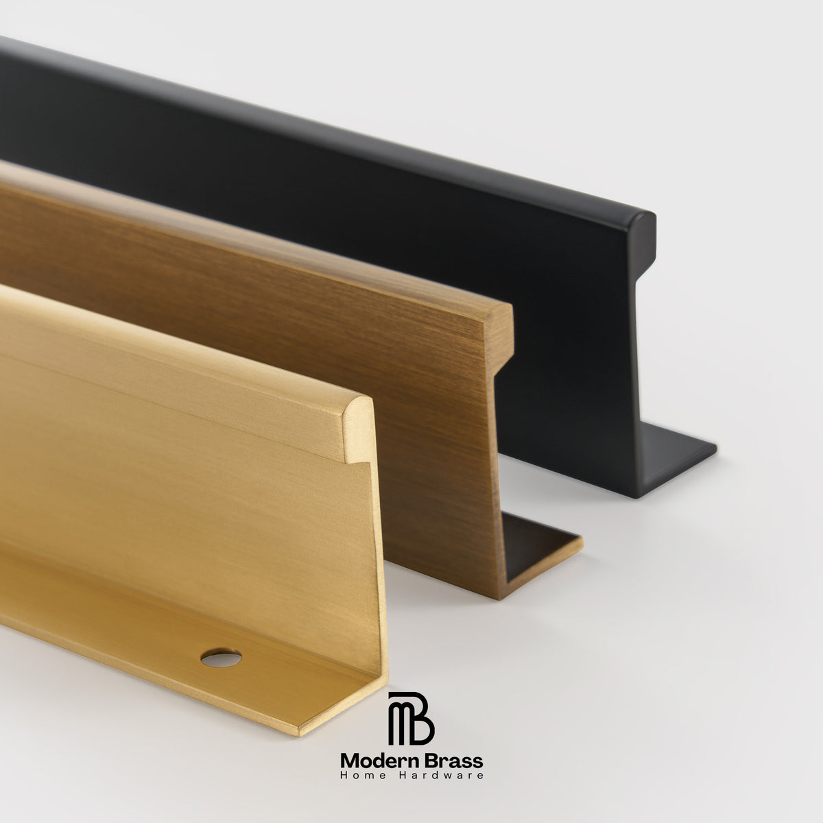 Three modern cabinet pull handles in brass, bronze, and black finishes shown in a clean studio shot on a light gray background, with the Modern Brass logo at the bottom.