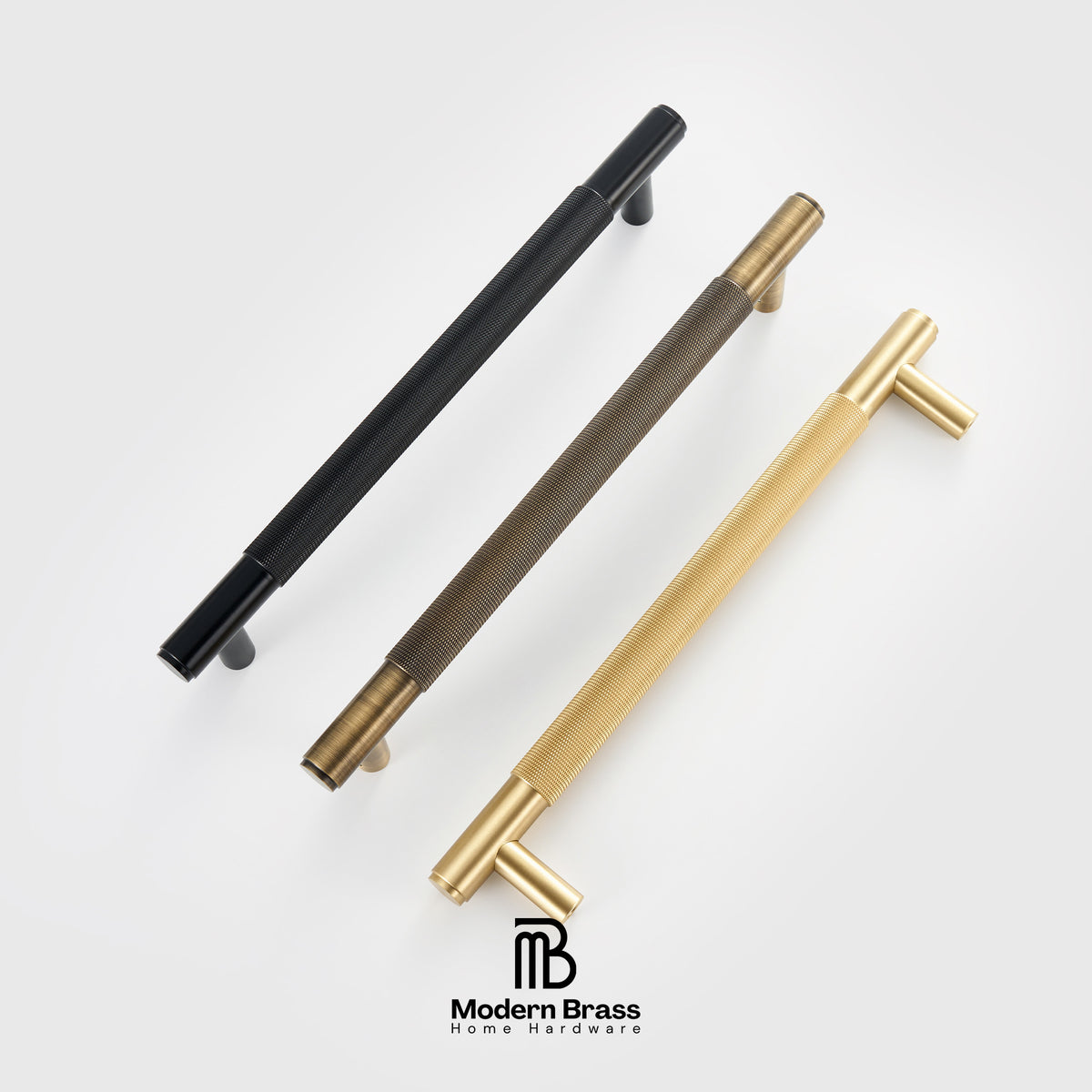 Three round cabinet knobs in black, matte brass, and brushed brass are arranged on a light beige surface against a warm beige background. The Modern Brass logo is visible at the bottom.