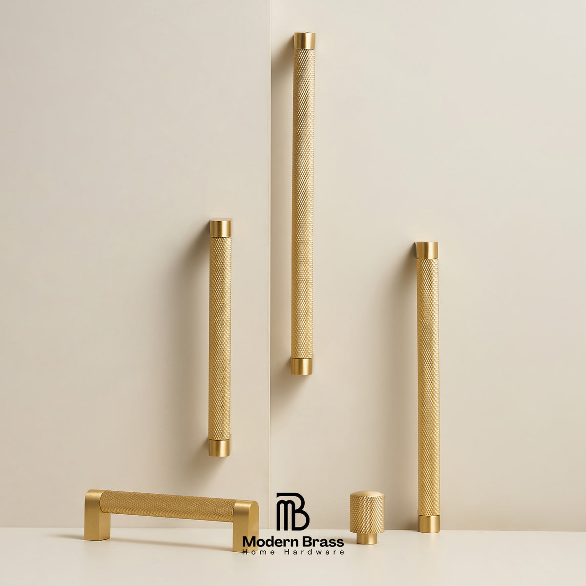 Five brass cabinet handles in various shapes and sizes, displayed on a clean off-white background with a brand logo at the bottom.