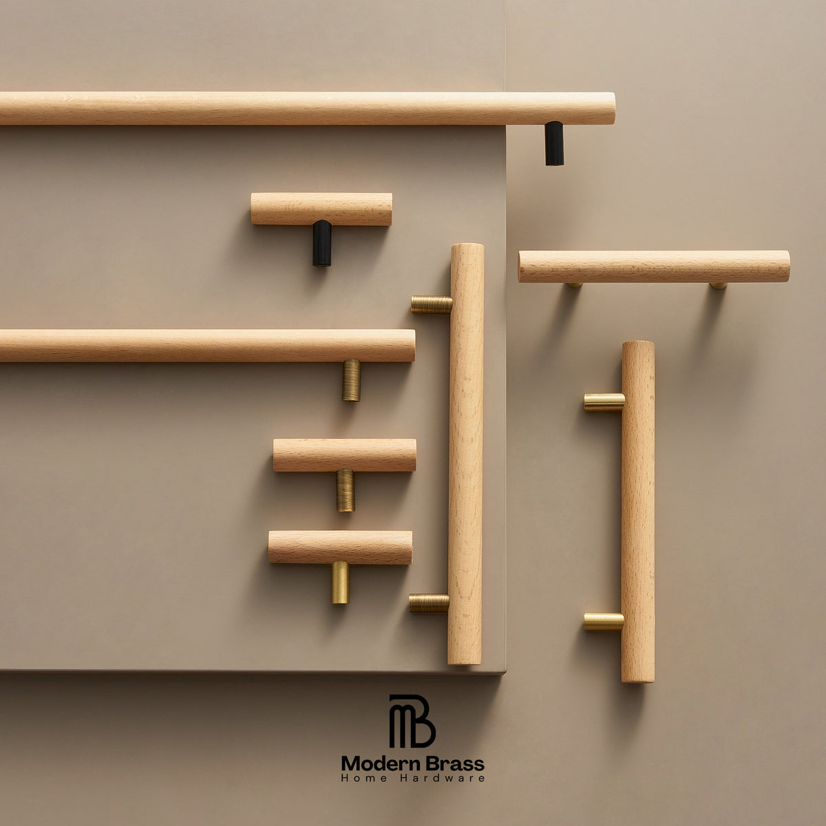 A styled product display of various modern cylindrical wooden cabinet handles in natural oak, mounted on a matching warm taupe wall. The handles feature brass and black hardware accents.